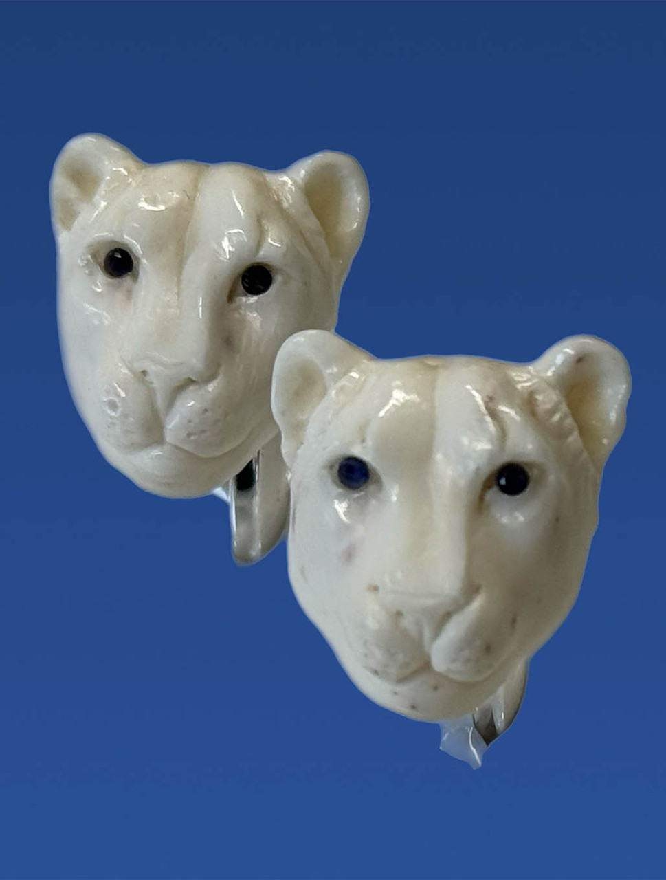 Hand Carved Bone Lion Cufflinks with Sapphire Eyes | Spivey - Harpers